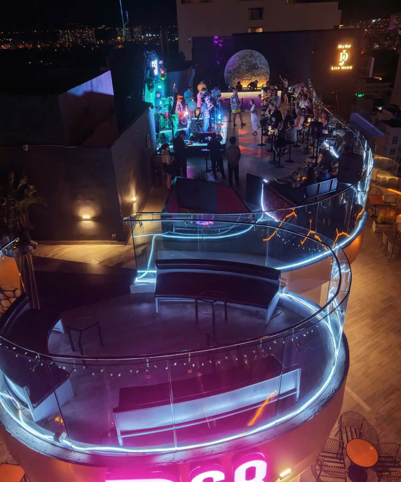 JD68 rooftop at night with the live stage and city lights